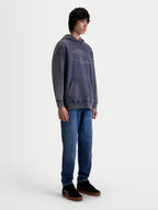 Alpinestars Infinite Washed Oversized Hoodie, Sportswear Lifestyle Pullover, Unisex, Washed Navy Blue, Snow-Wash Fleece with a relaxed fit, kangaroo pocket, and embroidered Alpinestars branding, on-model studio shot
