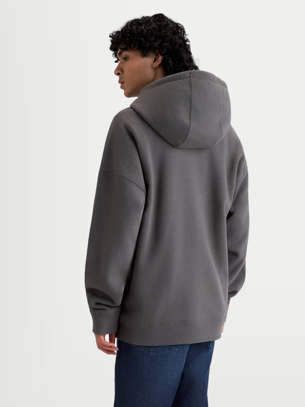 Alpinestars Entity Oversized huvtröja, grå sportswear fleece med dragkedja, lediga ytterkläder för herr och dam, ryggvy på modell som visar en avslappnad silhuett och ribbad fåll