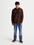 Alpinestars Entity Oversized huvtröja, brun zip-fleece för herr med avslappnad passform, Vislon-dragkedja framtill, känguruficka och vit broderad Astars-logotyp, tillverkad av bomull och återvunnen polyester.