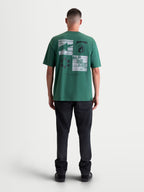 Alpinestars Checkback Oversized CSF t-shirt, grön kortärmad t-shirt, vy bakifrån som visar djärv rutgrafik och Astars-logotyp, avslappnad passform, bomull-polyesterblandning