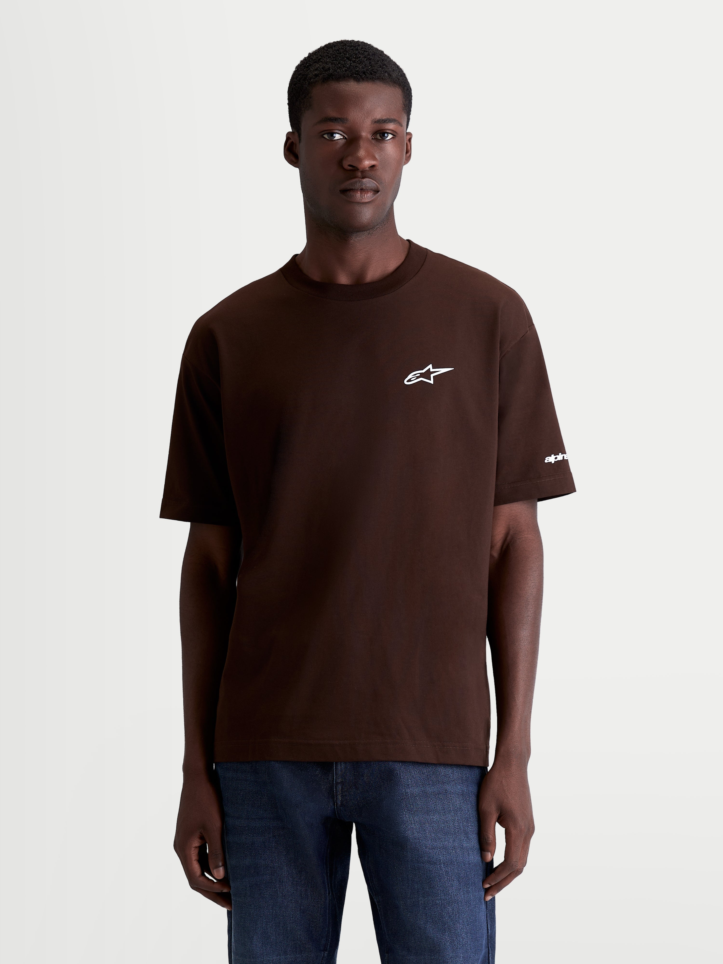 Alpinestars Mandate Oversized CSF Tee, Short Sleeve Casual Sportswear T-Shirt, Brown, featuring a white puff-print Astars chest logo and sleeve graphic, relaxed oversized fit, premium cotton-poly blend.
