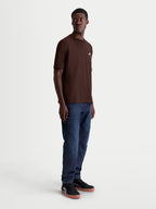 Alpinestars Mandate Oversized CSF t-shirt, brun kortärmad t-shirt med avslappnad oversized passform, pufftryckt Astars-logotyp framtill, mjuk bomulls- och polyesterblandning, sedd på modell.