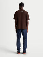 Alpinestars Mandate Oversized CSF t-shirt, brun kortärmad sportswear-t-shirt för herrar, avslappnad oversized passform, vit logotypgrafik på ryggen, ryggvy på modell