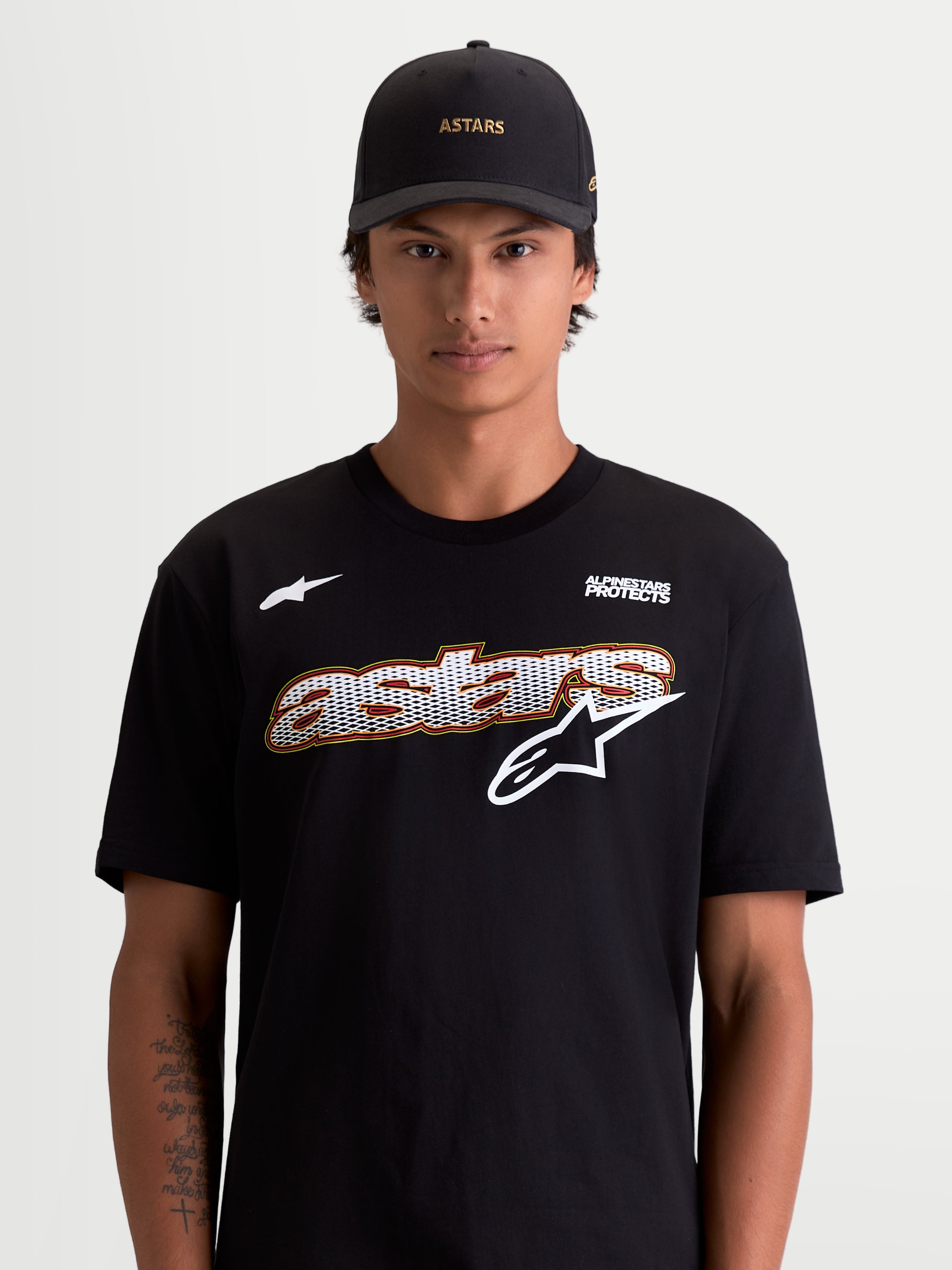 Alpinestars Cypress CSF Tee, Men's Short Sleeve Sportswear T-Shirt, Black and White, featuring a front mesh-fill graphic and Alpinestars Protects logo, on-model lifestyle view, premium cotton-poly material.