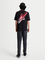 Alpinestars Meteor CSF Tee, Short Sleeve Sportswear T-Shirt, Black, Red, and White. On-model rear view featuring a large back Astars logo with an MX-inspired red and white gradient graphic.