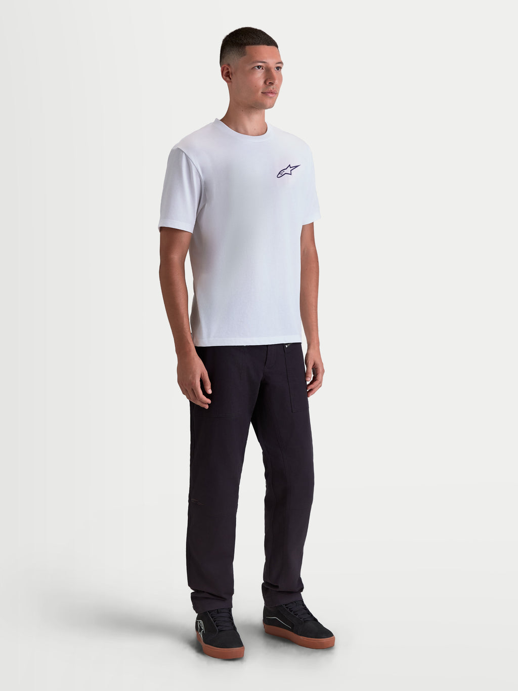 Alpinestars Combo Back CSF Tee, Short Sleeve Sportswear T-Shirt, White and Black, on-model front view featuring a small black Astars chest logo, premium cotton-poly blend fabric for everyday motorsport-inspired casual comfort.
