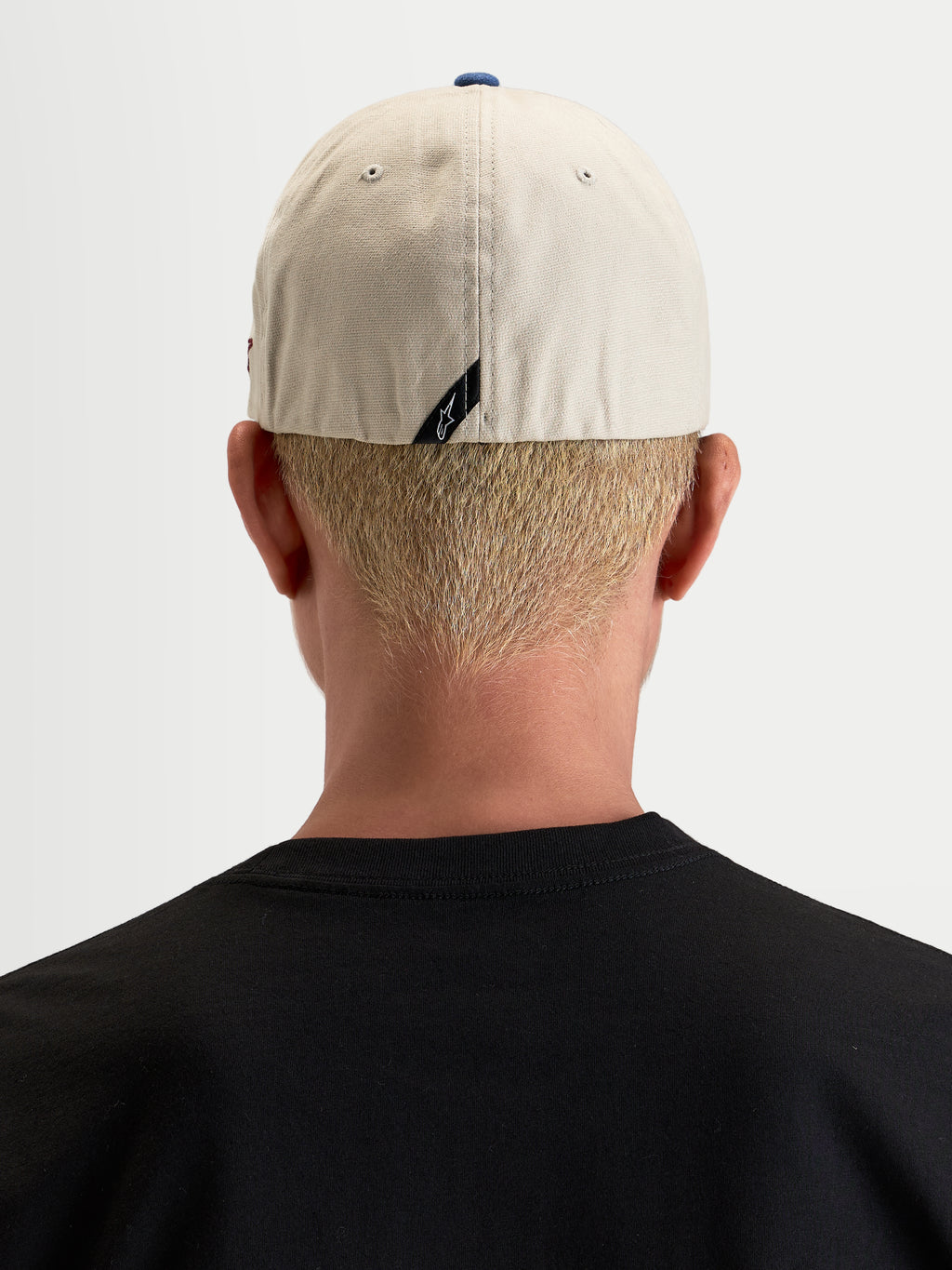 Alpinestars County Canvas Hat, casual sportswear cap, rear view worn by a model showcasing flex-back fit and subtle back label branding, sand and blue, oxford peached cotton fabric