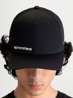 Alpinestars Points Hat, Black Curved Bill Sportswear Cap on Model, featuring White Alpinestars Word Logo on front, Lightweight Nylon Tactel Construction.