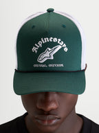 Alpinestars Baron Trucker Hat, casual sportswear cap worn by a model, green and white, featuring a curved bill, structured twill front, breathable poly mesh back, and embroidered Alpinestars word combo logo on the front