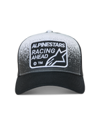 Alpinestars Gravel Trucker keps, svart och vit sportkeps med meshbaksida, grustexturtryck och vävd logotyplapp.