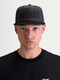 Alpinestars Stadium Snapback Hat, Sportswear Lifestyle Cap, Men's, Dark Gray and Black, featuring a structured crown with front ASTARS logo applique and flat bill design, shown on model.