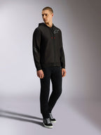Alpinestars Sessions V3 Hoodie, zip front poly fleece, Black and Grey, grey chest and sleeve logos, drawstring hood with red-tipped drawcords, full-body view of model in casual motorsport streetwear