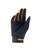Alpinestars A-Dura-handskar, mountainbikehandskar, mörkt guld och svart, handflatevy som visar syntetiskt mockamaterial, neoprenmanschett med gul kardborreknäppning vid handleden, designade för grepp och rörlighet vid cykling.