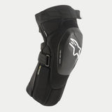 Alpinestars Vector Tech knäskydd, svarta MTB-knäskydd, halvstyvt skal med vit Astar-logotyp och Vector Tech-branding, ergonomisk kompressionspassform med justerbara remmar, lätt skyddsutrustning för terrängkörning