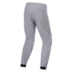 Alpinestars A-Dura Waterproof Pants, MTB-byxor, titaniumgrå, baksida, avsmalnande ben med svarta elastiska muddar, minimalistisk teknisk design för mountainbike