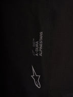 Detail of black Alpinestars A-Dura Ride Liner Shorts with white logos on 4-way stretch performance cycling fabric.