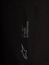 Detail of black Alpinestars A-Dura Ride Liner Shorts with white logos on 4-way stretch performance cycling fabric.