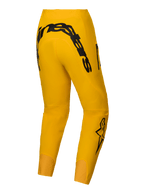 Alpinestars Begränsad Upplaga A-Supra Melt Gold byxor, mörkgula mountainbikebyxor för herrar med djärv MX-inspirerad svart Alpinestars-logotyp på bakoket och 4-vägs superstretchtyg
