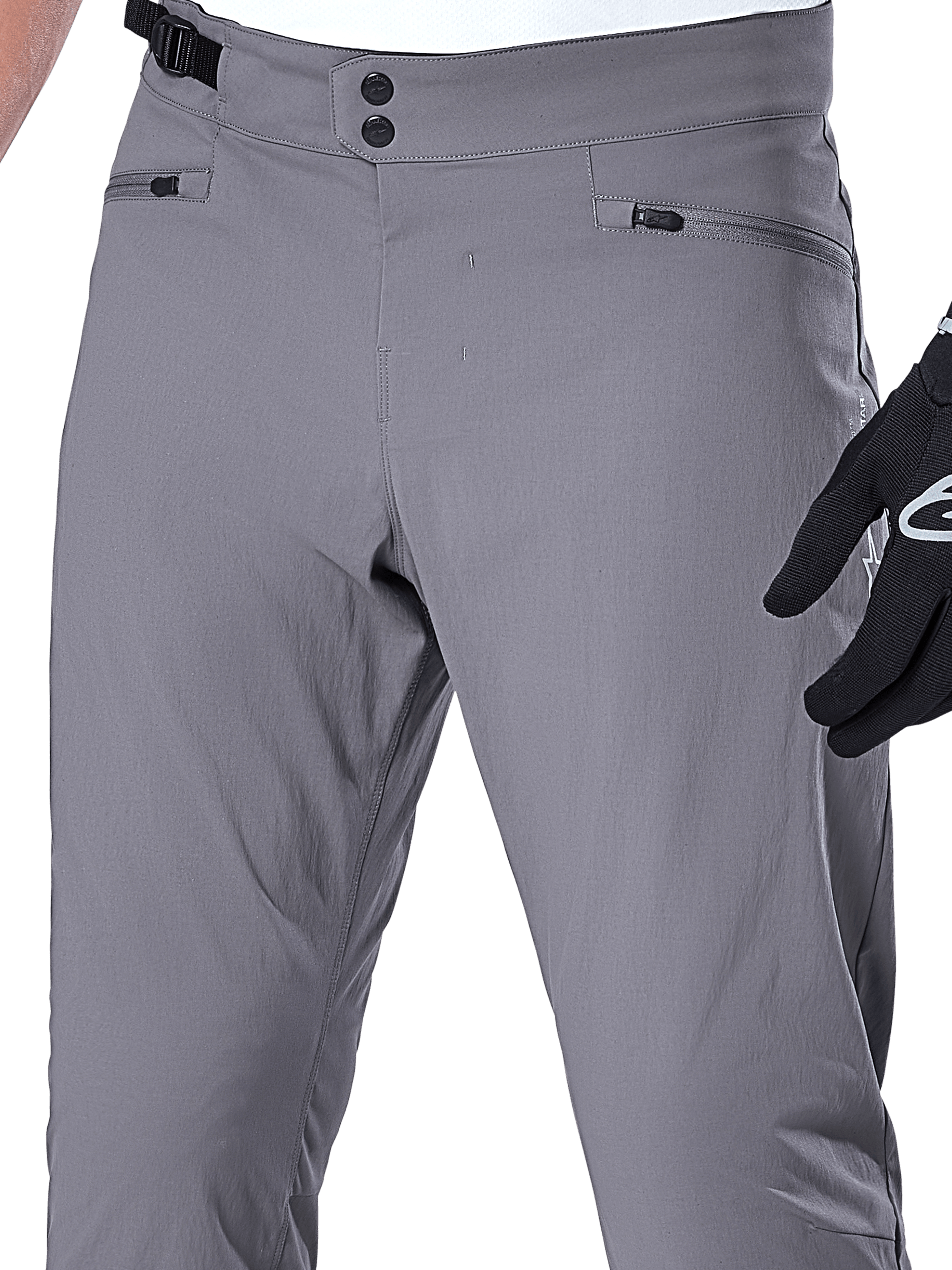 Alpinestars A-Dura byxor, MTB-byxor, mörkgrå, närbild av midjepartiet med dubbel tryckknappsstängning, justerbar sidostängning och blixtlåsförsedda fickor, slitstarkt stretchmaterial för mountainbikecykling