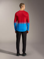 Alpinestars A-Dura ASTARS 2.0 long sleeve MTB jersey in bright red and blue gradient, back view on model.