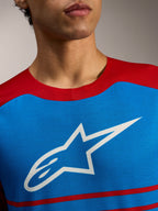 Alpinestars A-Dura Elite Tröja 2.0, blå och röd MTB-tröja med en stor vit stjärnlogotyp på bröstet.