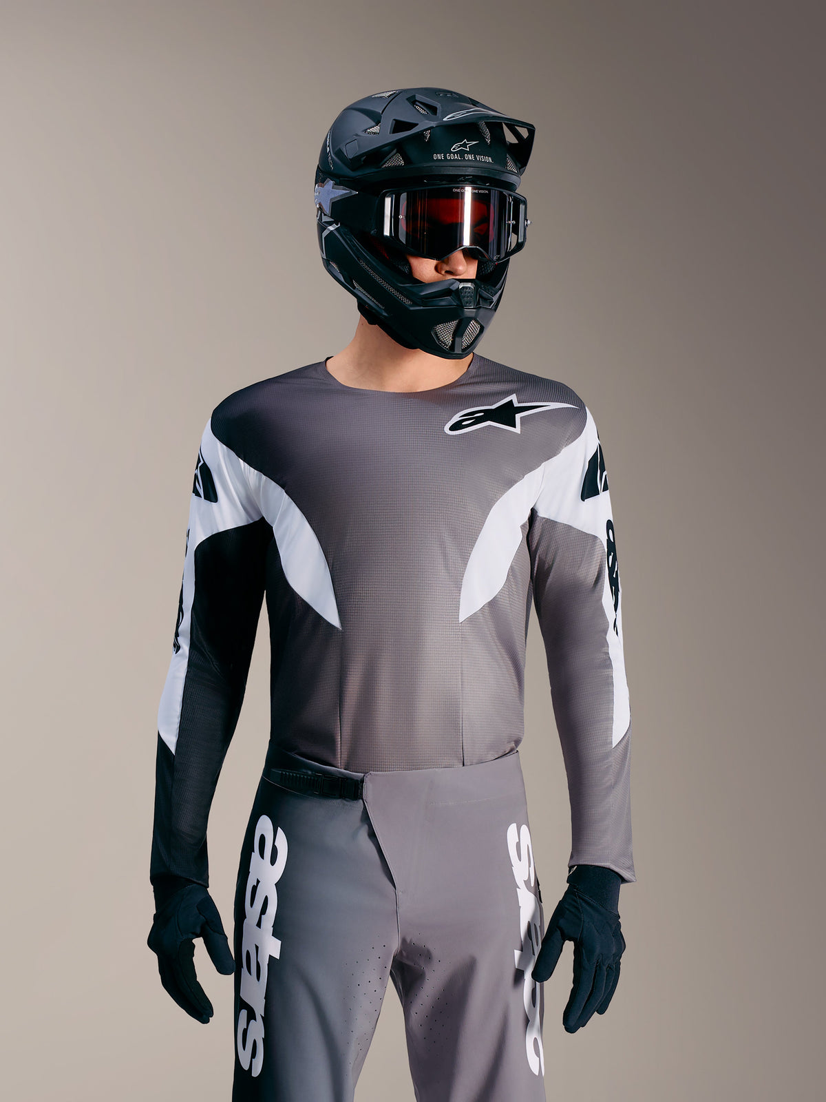Alpinestars A-Supra Elite Tröja i Faded Gray, mikroperforerad MTB-topp med vita accenter och logotypdetaljer.