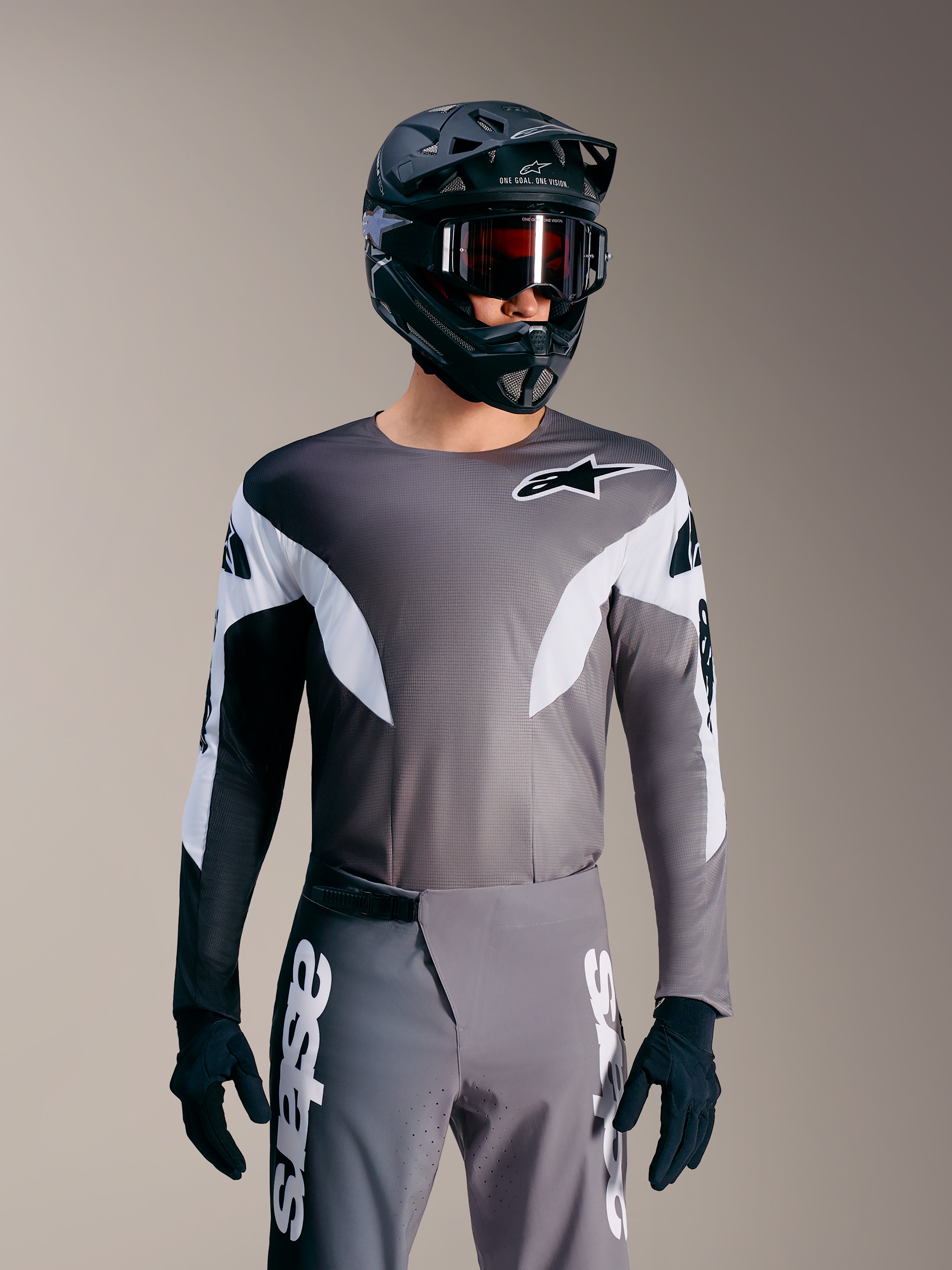 Alpinestars A-Supra Elite Tröja i Faded Gray, mikroperforerad MTB-topp med vita accenter och logotypdetaljer.