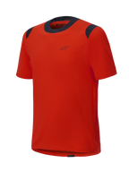 Alpinestars A-Dura Dri Wool kortärmad tröja, Spicy Orange med svarta meshpaneler på kragen och axlarna, minimalistisk design med en liten logotyp på bröstet, tekniska mountainbike-kläder