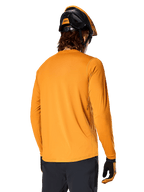 Alpinestars A-Dura Rocker Long Sleeve Jersey, Dark Gold, back view of rider wearing a black and orange MTB helmet, dark pants, and matching gloves, casual performance mountain bike apparel