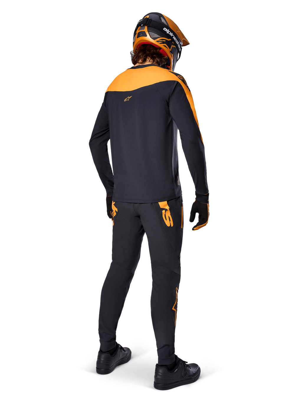 A-Supra Race Jersey - Long Sleeve, Black and Orange, rear view of a rider wearing matching MTB pants, orange and black helmet, and gloves, performance gear for mountain bike racing