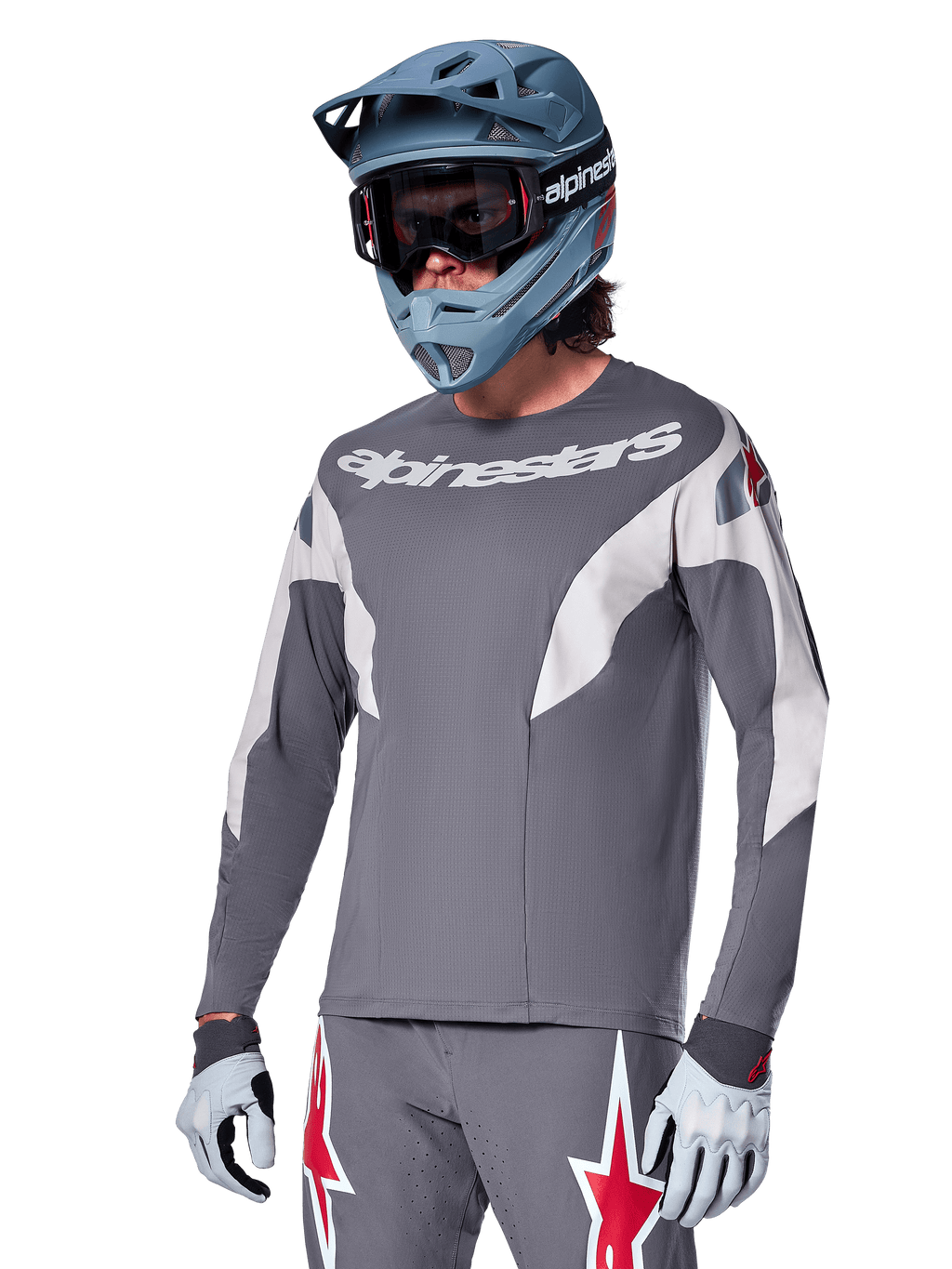Alpinestars A-Supra Race Jersey - Long Sleeve, Dark Gray with white and red accents, racing-style graphics, worn with matching gray pants, blue full-face helmet, and white gloves, professional MTB and downhill racing gear