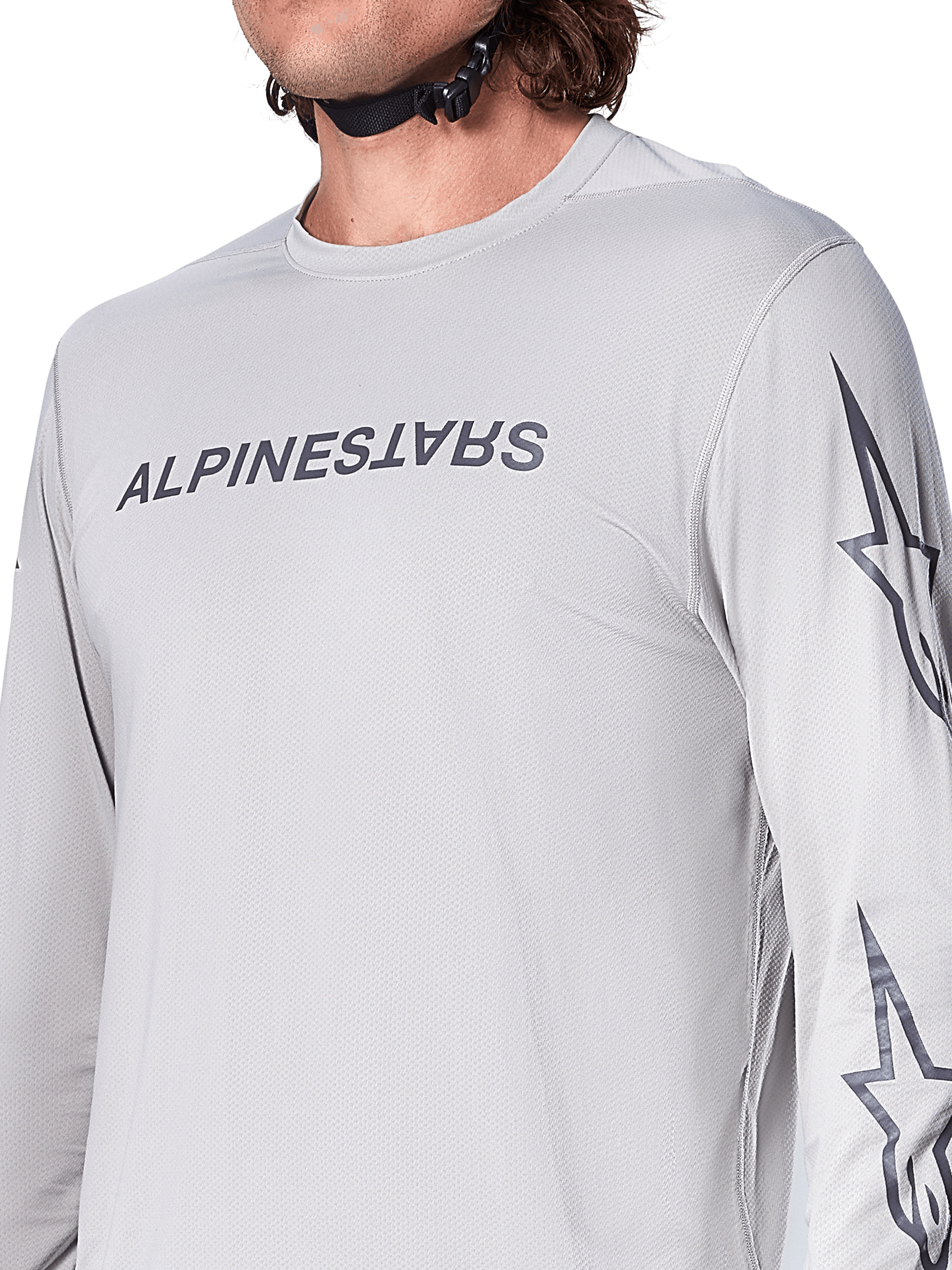 Alpinestars A-Dura Switch långärmad tröja, ljusgrå mountainbiketröja med mörkgrått ordmärke på bröstet och stjärnlogotyp på ärmen, ventilerande jacquard-textur, teknisk cykelutrustning för stigcykling