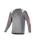 Alpinestars Youth A Supra Astar långärmad tröja, mörkgrå med vita axeldetaljer och rött tryck på ärmarna, vit logotyp på bröstet, ventilerande tekniskt material, rund halsringning, atletisk passform för mountainbike
