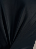 Svart jacquard-tygdetalj på Stella A-Dura Ride Jersey som framhäver dess ventilerande struktur och stretch.