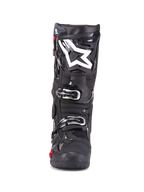 Alpinestars Tech 10 Enduro-stövlar, motocross-stövlar, svarta, sedda framifrån med vit stjärnlogotyp på skenbenet, silverfärgade spännen, stilren svart finish med robusta skyddspaneler, högpresterande skor för terrängkörning
