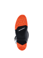 Alpinestars 2026 Tech 7 Enduro Boots, bottom view of the specialized dual-compound sole, Black and Orange Fluo, intricate tread patterns for superior off-road grip, featuring Alpinestars branding and wear limit indicator.