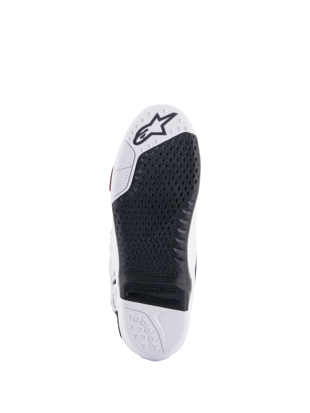 Alpinestars Tech 10 Supervented-stövlar, vy av sula i vitt och svart, med en utökad bikakedesign för grepp, svart utbytbar central insats, vit tå med Alpinestars stjärnlogotyp, optimerad för kontroll på fotpinnarna vid motocross
