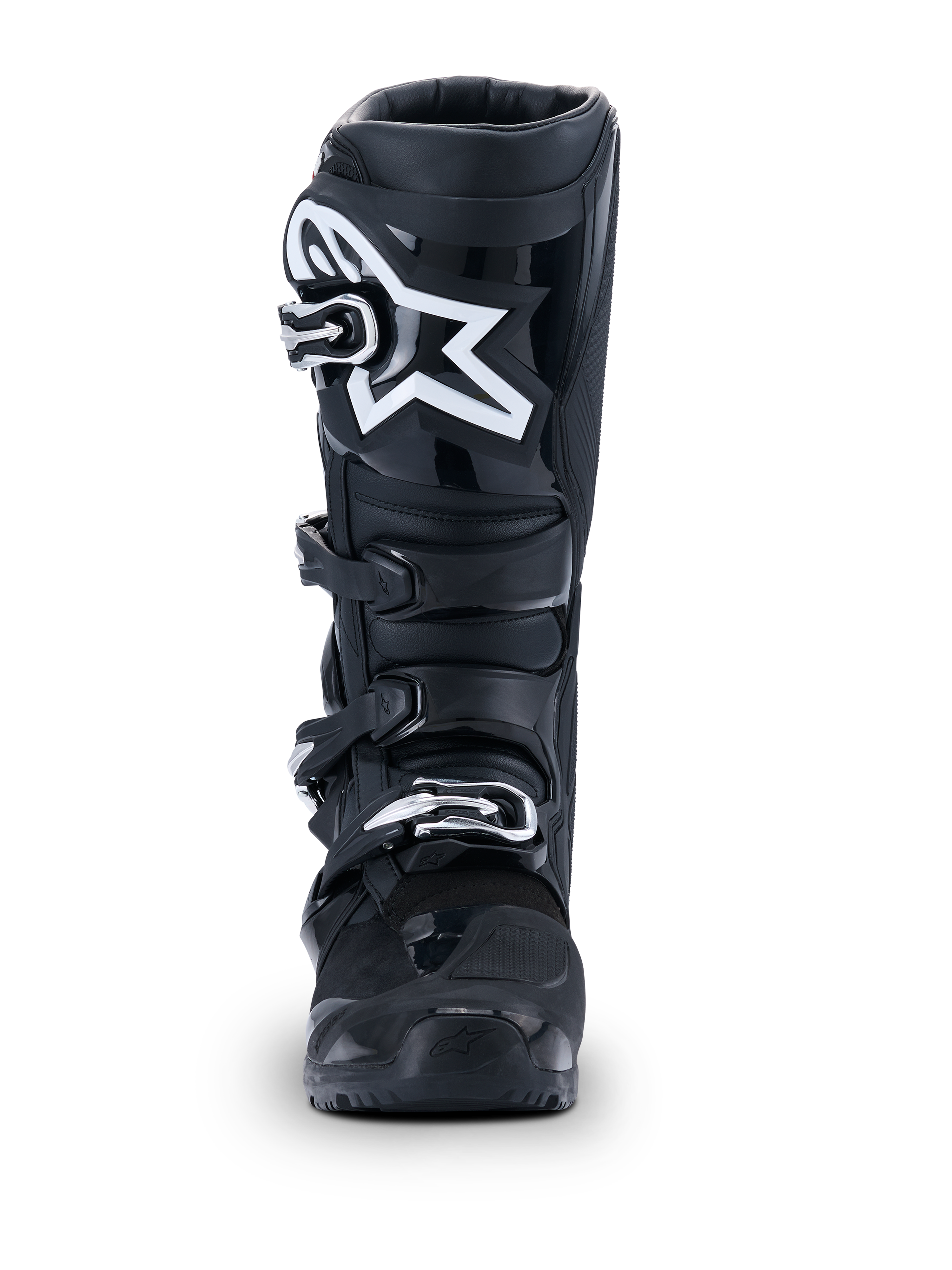 Alpinestars 2026 Tech 7 Enduro Drystar® stövlar, svarta motocross-stövlar, vy framifrån, med ett hållbart spännsystem med fyra spännen och en framträdande vit stjärnlogotyp på smalbenet, designade för off-road- och enduro-prestanda