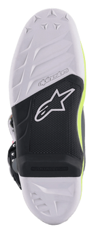 Alpinestars Tech 7 Boots, Motocross Boots, detailed view of the sole featuring a white and black compound design, replaceable footpeg insert, textured grip with the Alpinestars star logo, and fluorescent yellow accents