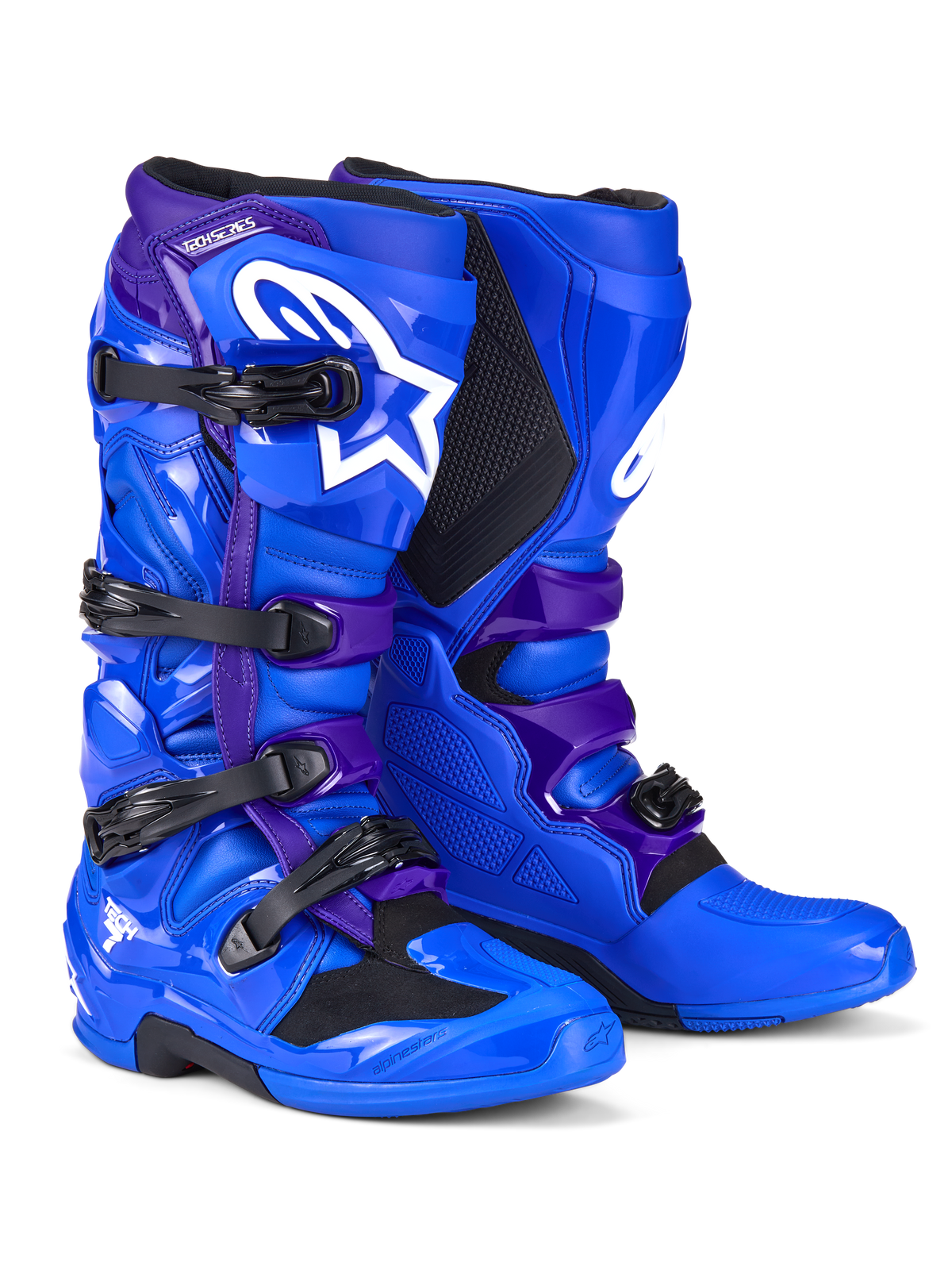 Alpinestars Tech 7-stövlar, motocrossstövlar, blå och lila, med vita Alpinestars-logotyper, TPU-skyddspaneler, stängningssystem med fyra spännen och robust terrängsuldesign