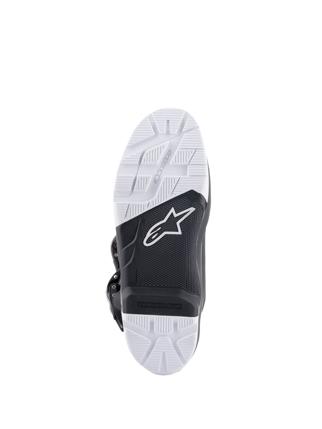 Alpinestars Tech 7 Enduro-stövlar, vy av sulan som visar den specialutvecklade sammansatta slitsulan, svart och vit tvåtonsdesign med texturerat greppmönster, vit stjärnlogotyp och en utbytbar fotpinnsinsats.