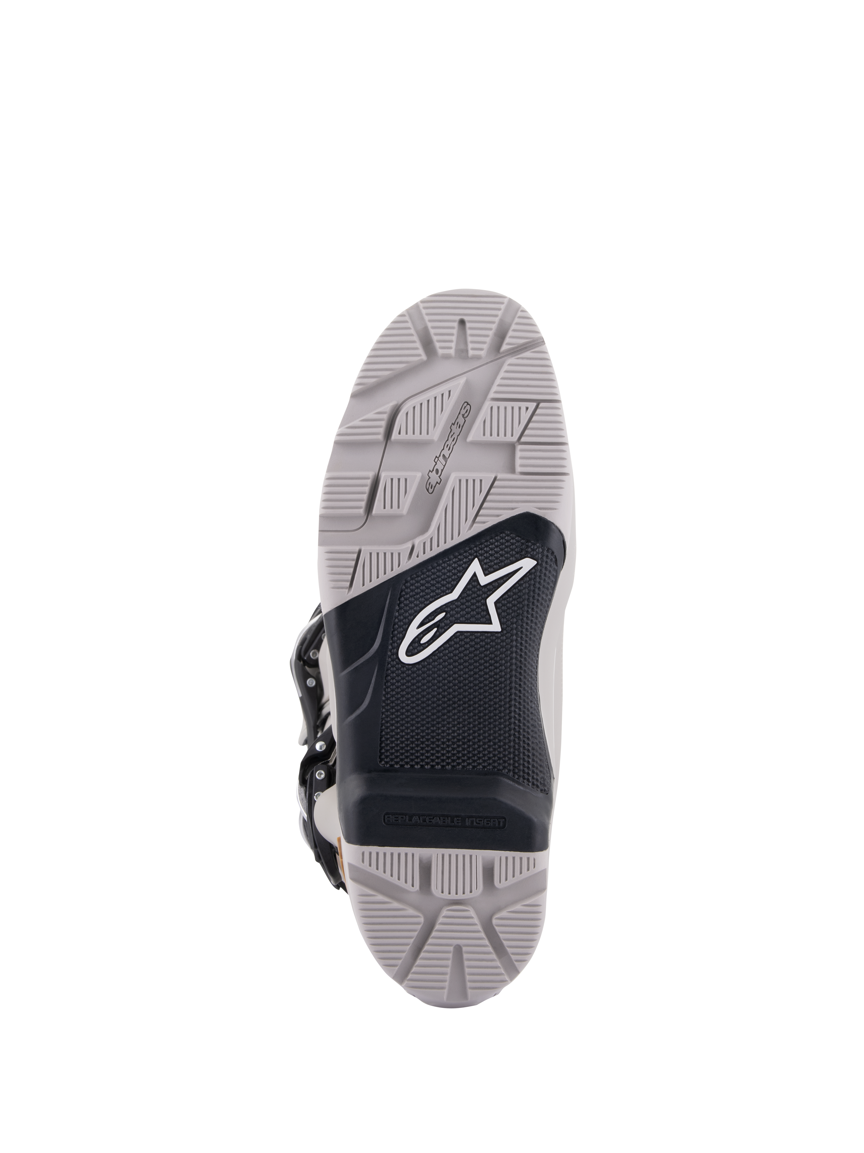 Alpinestars Tech 7 Enduro Drystar®-stövlar, vy av sulan, grå och svart, greppvänligt mönster med en texturerad svart mittpanel, vit Astar-logotyp, har ett utbytbart inlägg för hållbarhet och grepp vid endurokörning.
