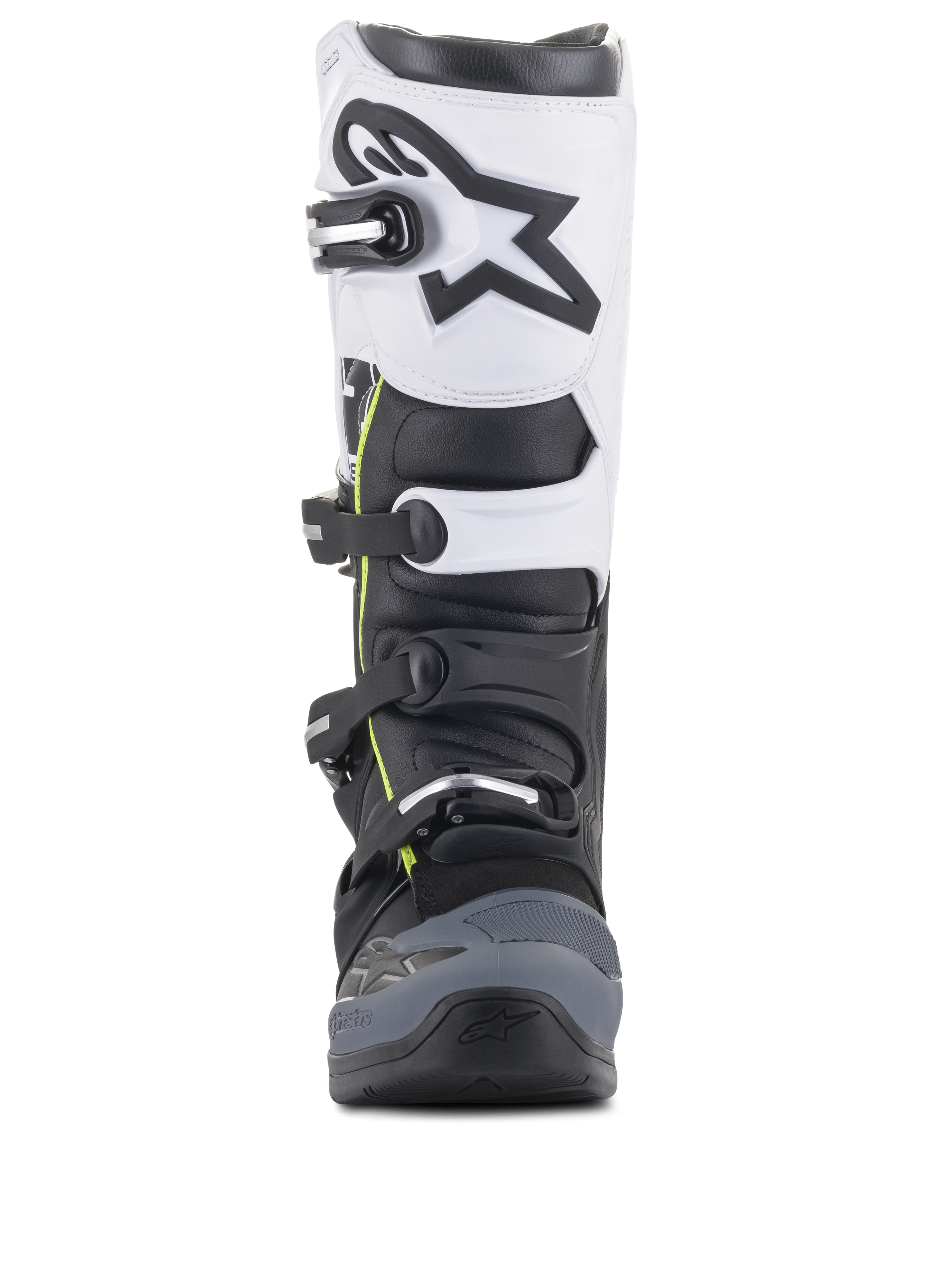 Alpinestars Tech 5-stövlar, motocross-stövlar, svart, mörkgrå och vit, vy framifrån med ett spännsystem med flera spännen, vit övre panel med svart Astars-logotyp, mörkgrå förstärkt tå och subtila gula detaljer