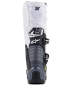 Alpinestars Tech 5-stövlar, motocross-stövlar, svart, mörkgrå och vit, vy bakifrån som visar vit ovandel med Tech 5-logotyp, grå dragspelsformade flexzoner och svart hälskydd med Tech Series-logotyp