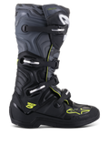 Alpinestars Tech 5 stövlar, motocross- och offroad-stövlar, profilvy från sidan, svart och cool grå med neongula detaljer, kamouflagemönster, justerbara spännen och robust skyddande sula.