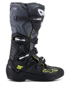 Alpinestars Tech 5 stövlar, motocross- och offroad-stövlar, profilvy från sidan, svart och cool grå med neongula detaljer, kamouflagemönster, justerbara spännen och robust skyddande sula.