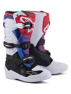 Alpinestars Youth Tech 7S Boots, Motocross Boots, White Black Rainbow, featuring a white and black base with red, blue, and purple accents, multi-buckle closure system, and protective shin plate for off-road racing