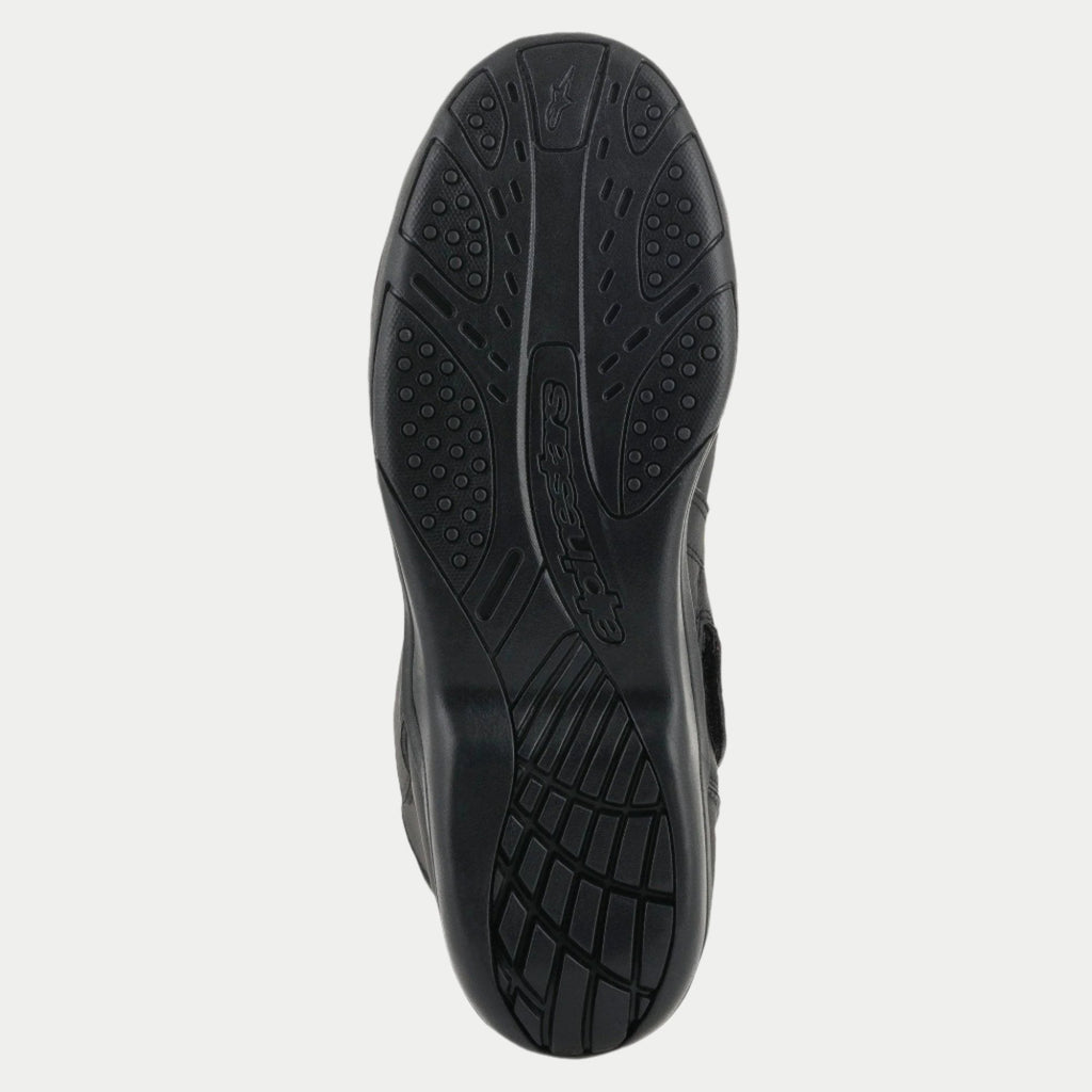 Alpinestars Origin Drystar® Boots, Black, detailed view of the rubber outsole, textured grip pattern with embossed logo, durable sole for motorcycle touring