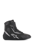 Alpinestars Fastback 2 Drystar Waterproof Shoes, Black and White High-Top Motorcycle Sneakers, side profile featuring white star logo and silver accents, lace-up closure with hook-and-loop strap, waterproof urban riding footwear