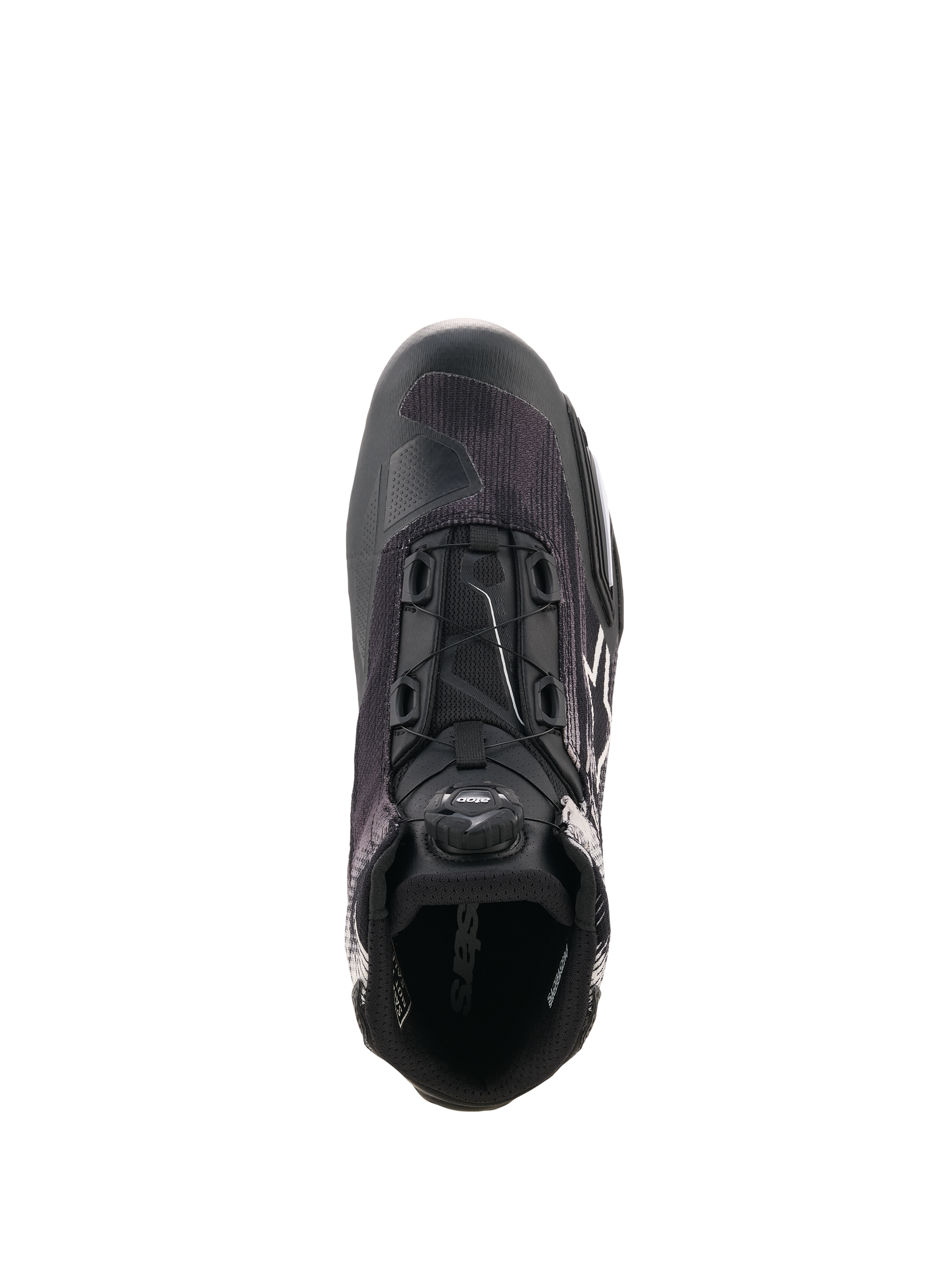 Alpinestars Celer Superair-skor, svart och vit motorcykelsko sedd uppifrån, med det integrerade Rotor-stängningssystemet, ventilerande ovandel i textil och sportinspirerad design för prestanda i varmt väder.